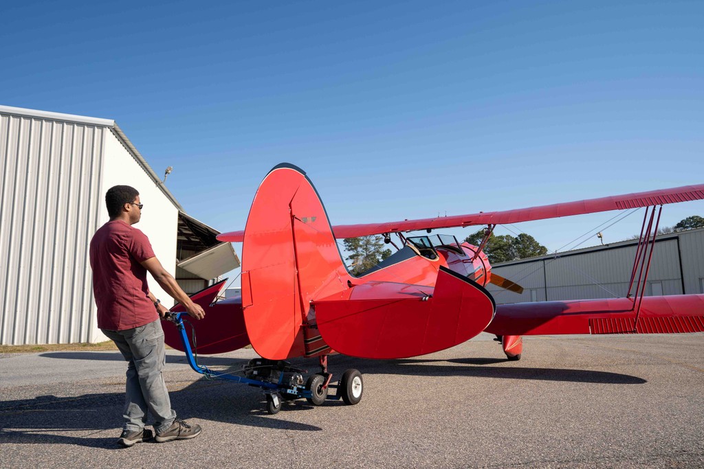 Biplane flight over beach